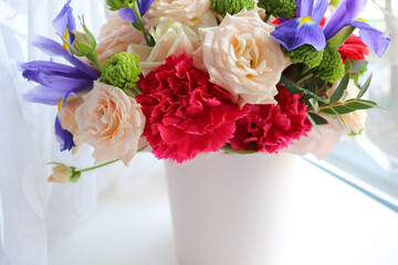 composition of a bouquet of roses and gift box 