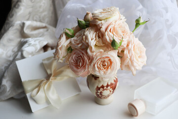 composition of a bouquet of roses and gift box 
