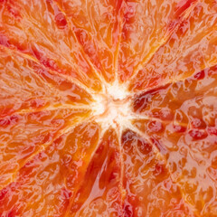 closeup of sliced blood orange with red and orange details