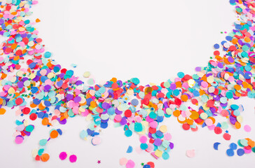 colorful confetti on a white background. Top view.
