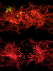 China, Chinese vs Albania, Albanian smoky mystic flags placed side by side. Thick colored silky abstract smoke flags.