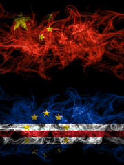 China, Chinese vs Cape Verde, Cabo Verde smoky mystic flags placed side by side. Thick colored silky abstract smoke flags.