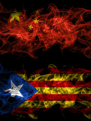 China, Chinese vs Catalonia, Catalan, Catalonian, Spain smoky mystic flags placed side by side. Thick colored silky abstract smoke flags.