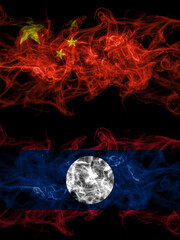 China, Chinese vs Laos smoky mystic flags placed side by side. Thick colored silky abstract smoke flags.