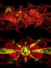 China, Chinese vs Macedonia, Macedonian smoky mystic flags placed side by side. Thick colored silky abstract smoke flags.