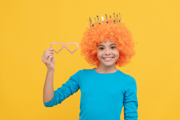 imagine herself a queen. cheerful child wear diadem. teen girl in party glasses. being a clown