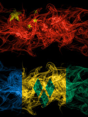 China, Chinese vs Saint Vincent and the Grenadines smoky mystic flags placed side by side. Thick colored silky abstract smoke flags.