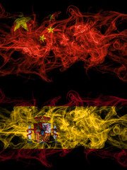 China, Chinese vs Spain, Spanish smoky mystic flags placed side by side. Thick colored silky abstract smoke flags.