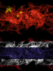 China, Chinese vs Thailand, Thai smoky mystic flags placed side by side. Thick colored silky abstract smoke flags.