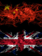 China, Chinese vs United Kingdom, Great Britain, British smoky mystic flags placed side by side. Thick colored silky abstract smoke flags.