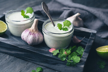 Cilantro garlic sauce with lime juice and olive oil - obrazy, fototapety, plakaty