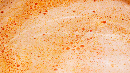 Organic Liquid Bubbles Background, Oil and Red Sause with Soap Mix
