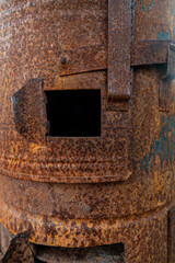 Very old stove covered with rust after the fire.