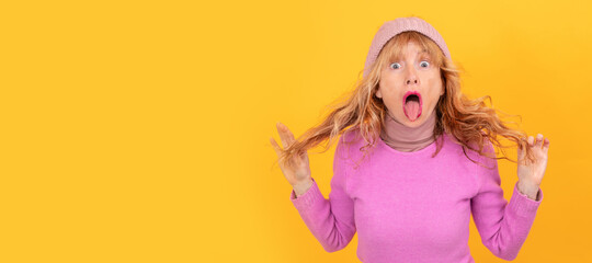 portrait of amazed adult woman clutching hair