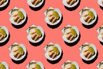 Scallop sashimi on shell with daikon and lime on pink background