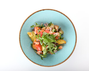 vegetable salad with tomatoes and herbs on a white plate 
