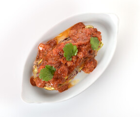 zucchini and stewed vegetables on a white plate 