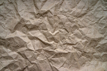 The texture of crumpled yellow craft paper