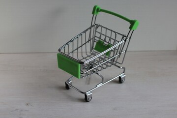 The metal cart is empty on a light background.