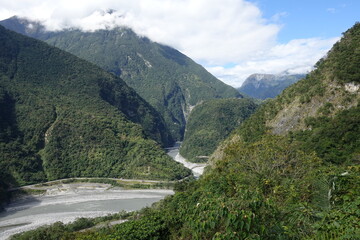 Plakat Scenic View Of River By Mountains Against Sky