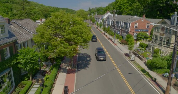 Lowering Aerial View of a Main Street in a Small Town in Long Island
