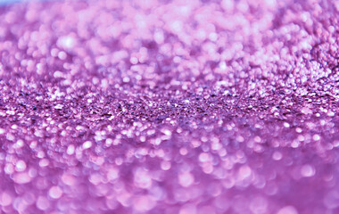 Background of abstract violet glitter lights. defocused