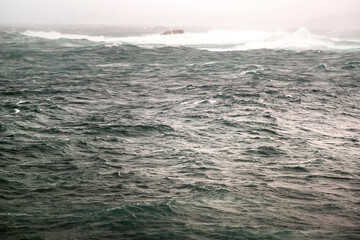 big ocean waves breaking  in atlantic ocean coast during sea storm 
