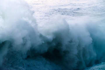 giant waves breaking on a stormy day in atlantic sea ocean