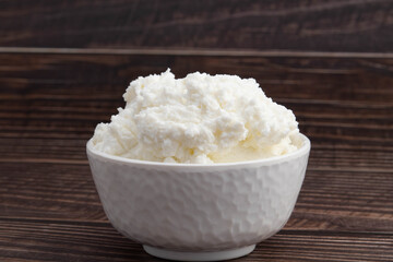 Natural Ayurvedic Freshly Churned White Butter Also Known As Safed Makhan Malai Or Makkhan Is Used For Skincare As Beauty Product And Has Multiple Health Benefits. Wooden Background With Copy Space