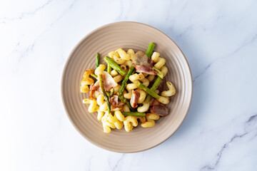 Fried Bacon roasted asparagus pasta in a plate