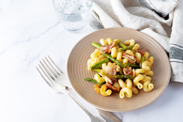 Fried Bacon roasted asparagus pasta in a plate