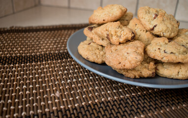Tasty chocolate chips cookies in a grey plate