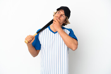 Young blonde man playing baseball isolated on white background and looking up