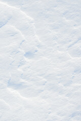 Fresh clean white snow background texture. Winter background with snowflakes and snow mounds. Snow lumps. Seasonal landscape details.