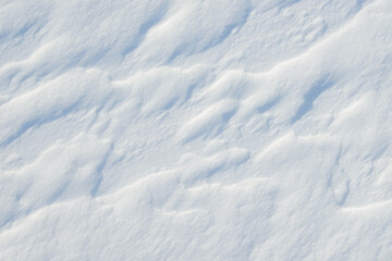 Fresh clean white snow background texture. Winter background with snowflakes and snow mounds. Snow lumps. Seasonal landscape details.