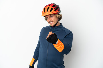 Young blonde cyclist man isolated on white background making money gesture