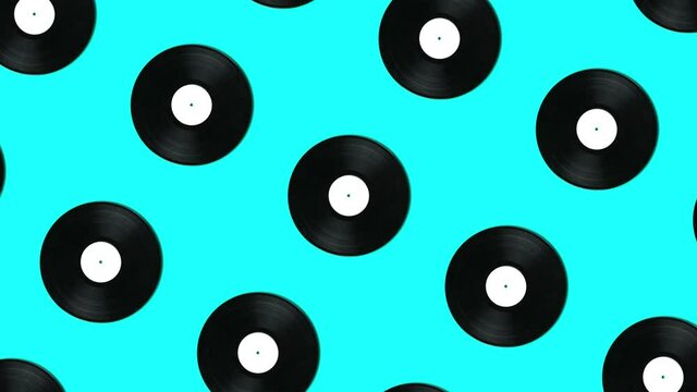 Retro vinyl disks in geometric pattern on a blue background. Simple motion graphics music animation concept