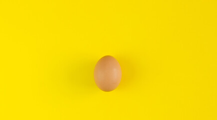 Egg on a yellow background. Background for design. Easter background. Easter.Copy space.