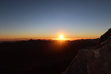 The beautiful and serene sunrise on top of the Moses mountain in Saint Catherin in Sinai in Egypt