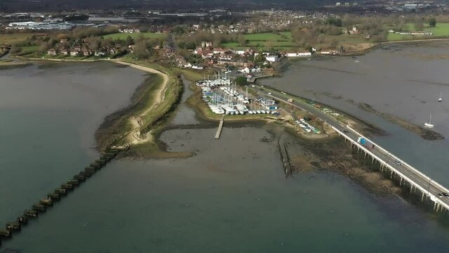 Aerial video of the road bridge and the old ruined railway bridge that link Langstone to Hayling Island.