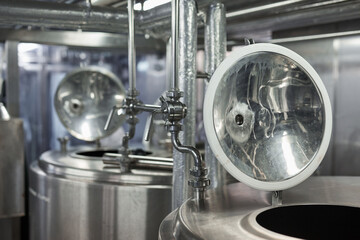 Background image of opened mixing barrels in workshop at industrial food factory, copy space