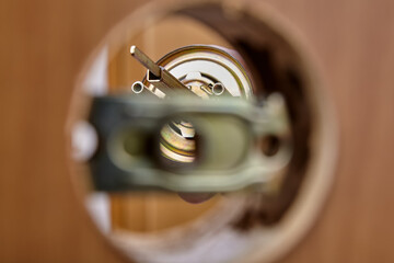 Door handle mechanism shutter is visible in hole of latch assembly.