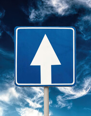 White arrow on a blue background. One-way traffic warning sign