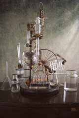 Fototapeta na wymiar orologio a valvole vecchie con provette di vetro di laboratorio chimico