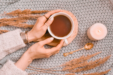 person with cup of tea