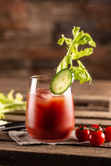 Classic bloody mary or virgin mary vodka cocktail in a cup with as a hangover drink in a rustic envrionment © weyo