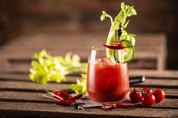 Classic bloody mary or virgin mary vodka cocktail in a cup with as a hangover drink in a rustic envrionment © weyo