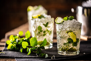 Mojito or virgin mojito long rum drink with fresh mint, lime juice, cane sugar and soda