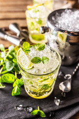 Mojito or virgin mojito long rum drink with fresh mint, lime juice, cane sugar and soda