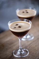 Espresso martini vodka short drink as a coffee cocktail inclduing coffee liqueur and vanilla syrup